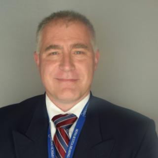 Headshot of Greg Noel.