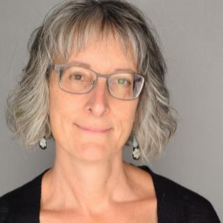 Headshot of Susan Doucette.
